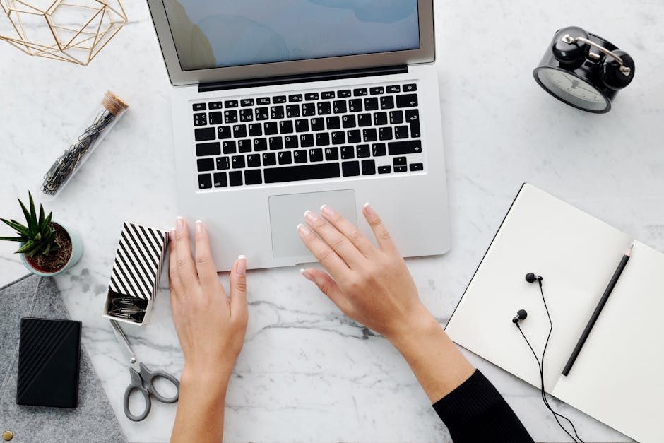 A sleek laptop on a wooden desk in a cozy home office setting, capturing digital workspace vibes.