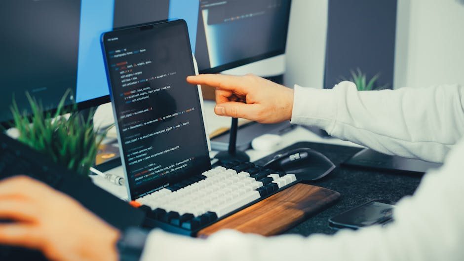 Recruiter reviewing candidates on a laptop screen with interview notes scattered on a desk.