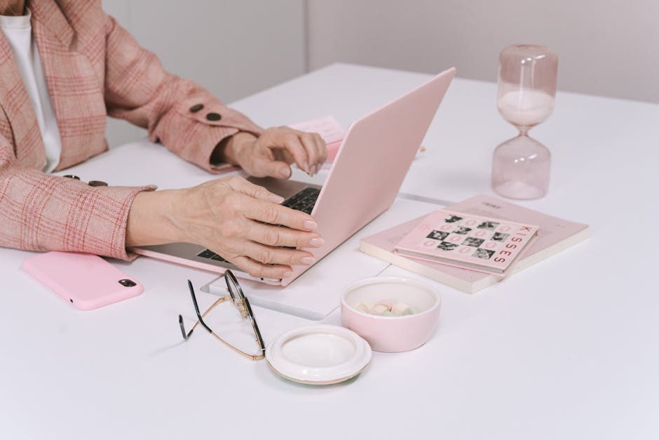 Close-up of hands using a calculator next to a company invoice, depicting a financial calculation concept.